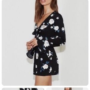 Kendall& Kylie black romper with white and blue flowers size small